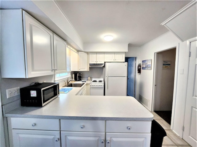 9903 2nd Ave, Stone Harbor, NJ 08247 - kitchen with white appliances, a sink, under cabinet range hood, and light countertops