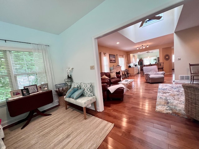 48 Wynndemere Ct, Cape May Court House, NJ 08210 - living area with plenty of natural light, wood finished floors, and lofted ceiling