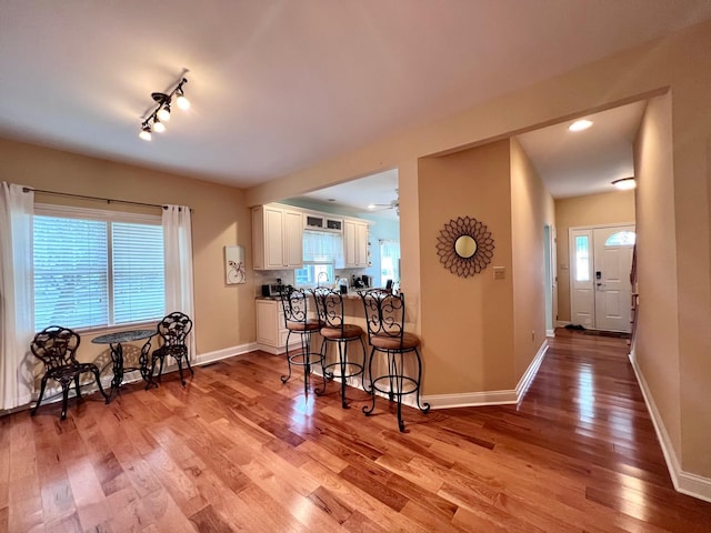48 Wynndemere Ct, Cape May Court House, NJ 08210 - kitchen featuring a kitchen breakfast bar, light wood-style floors, white cabinetry, baseboards, and recessed lighting