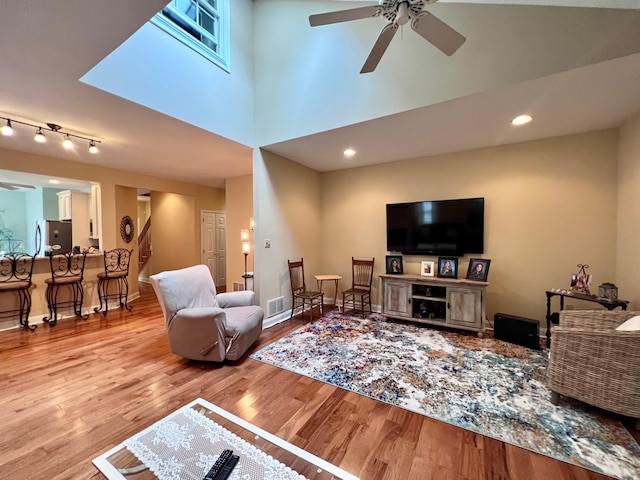 48 Wynndemere Ct, Cape May Court House, NJ 08210 - living room with a ceiling fan, wood finished floors, baseboards, and a high ceiling