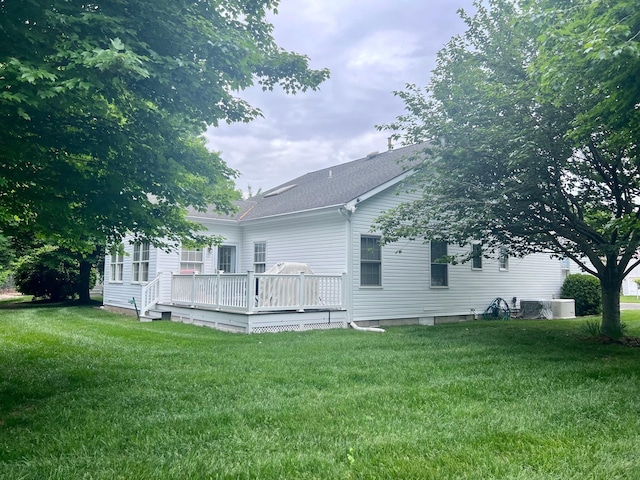 48 Wynndemere Ct, Cape May Court House, NJ 08210 - rear view of property featuring a wooden deck, a yard, and a shingled roof