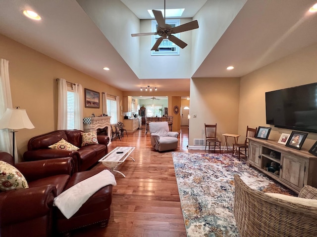 48 Wynndemere Ct, Cape May Court House, NJ 08210 - living area featuring a skylight, a ceiling fan, wood finished floors, a towering ceiling, and recessed lighting
