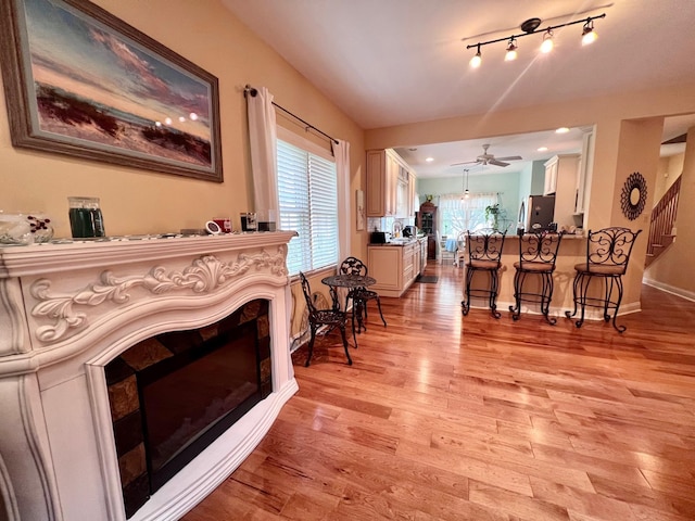 48 Wynndemere Ct, Cape May Court House, NJ 08210 - living room featuring a fireplace, light wood finished floors, stairway, and a ceiling fan