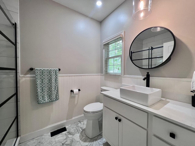 48 Wynndemere Ct, Cape May Court House, NJ 08210 - full bath featuring a stall shower, a wainscoted wall, marble look tile flooring, toilet, and vanity