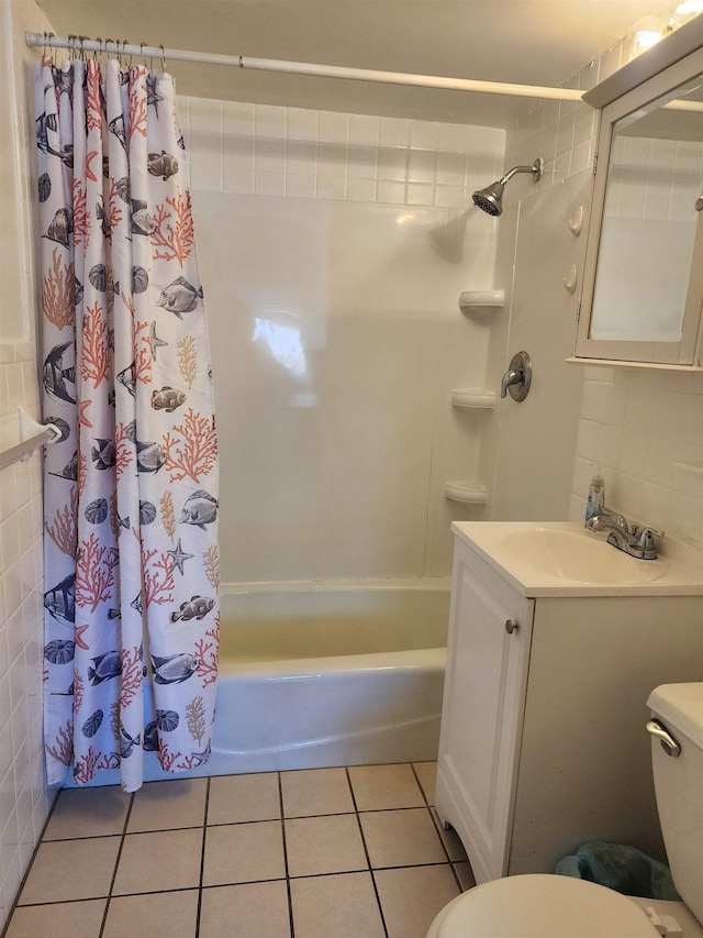 full bathroom with tile patterned floors, vanity, toilet, and shower / bath combo with shower curtain