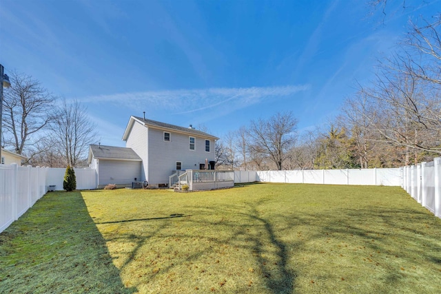 view of yard with a fenced backyard and a wooden deck