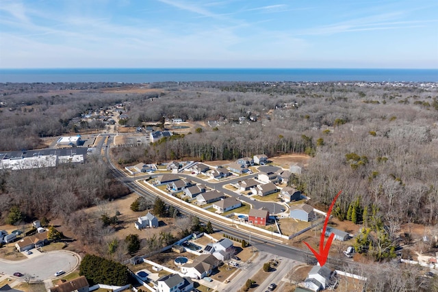 birds eye view of property with a wooded view