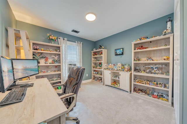 carpeted home office featuring visible vents and baseboards