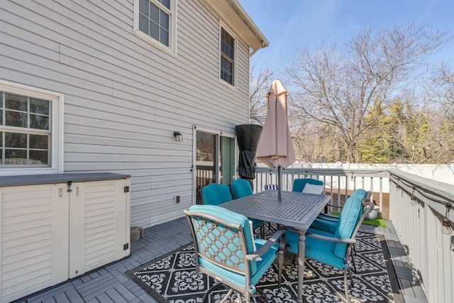 wooden deck with outdoor dining space