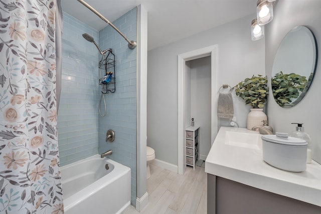 full bath featuring toilet, wood finished floors, vanity, baseboards, and shower / bath combo with shower curtain