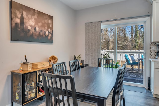 dining space with wood finished floors