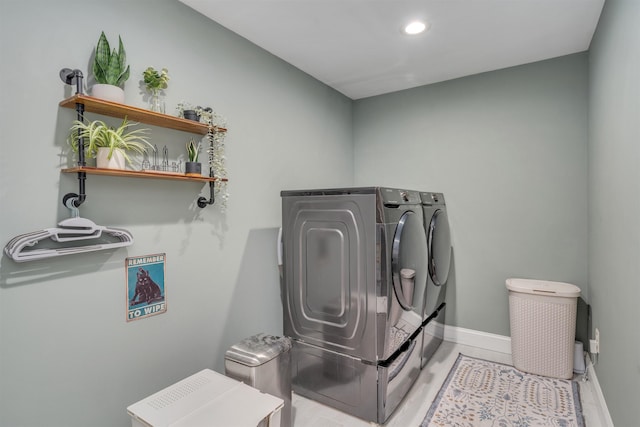 laundry area featuring laundry area, recessed lighting, baseboards, and washing machine and clothes dryer