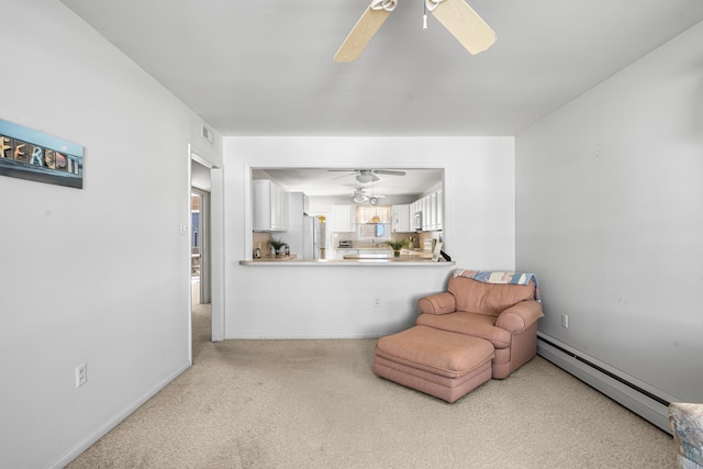 28 89th St, Sea Isle City, NJ 08243 - living area with carpet, baseboards, visible vents, a ceiling fan, and a baseboard heating unit