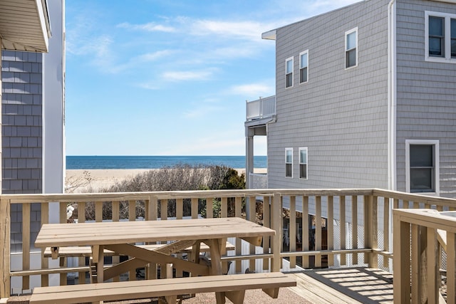 28 89th St, Sea Isle City, NJ 08243 - wooden deck with a beach view, outdoor dining area, and a water view