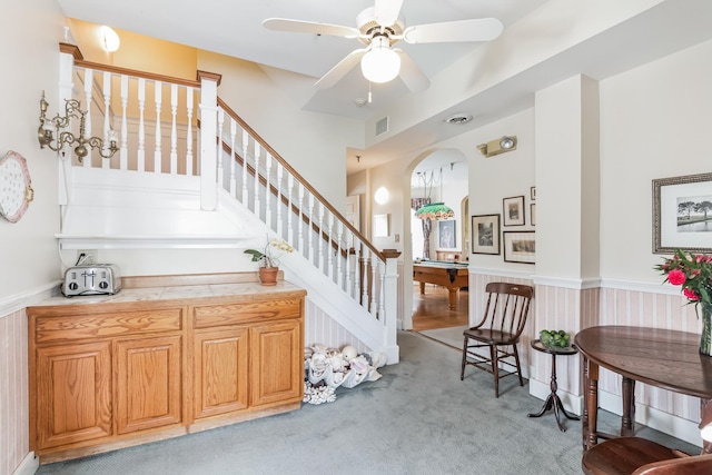 staircase featuring carpet flooring, ceiling fan, and pool table