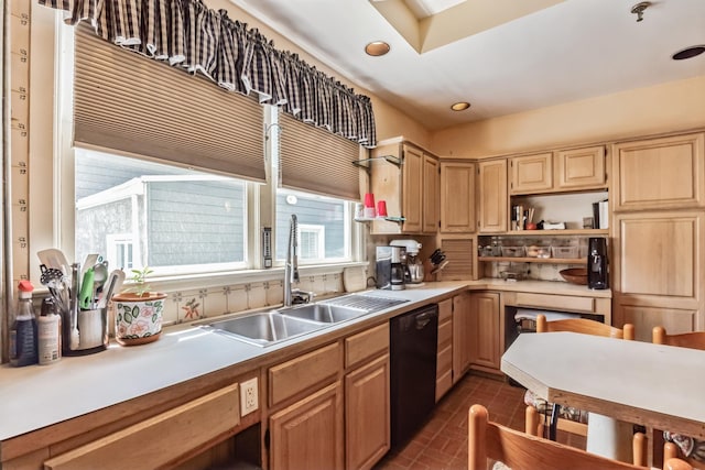 kitchen featuring light brown cabinetry, black dishwasher, and sink