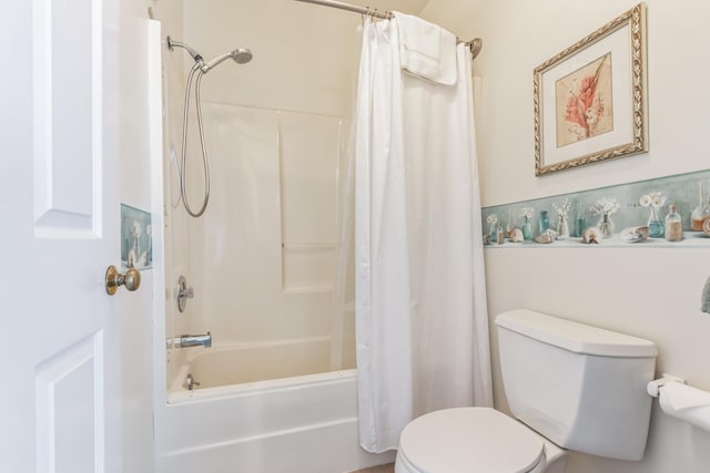 bathroom with shower / bath combination with curtain and toilet