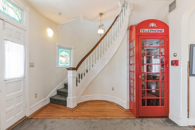 view of carpeted entrance foyer