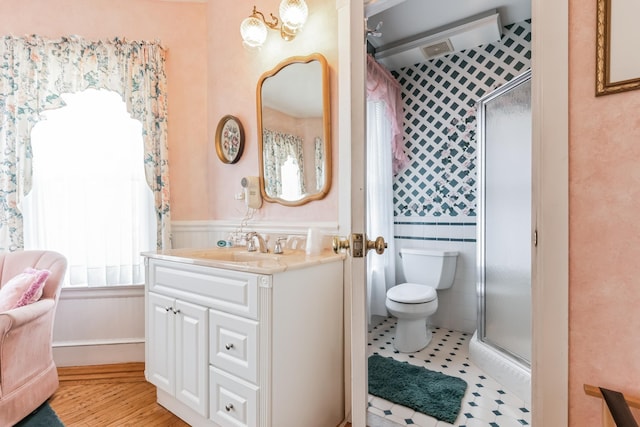 bathroom featuring an enclosed shower, vanity, toilet, and tile patterned flooring