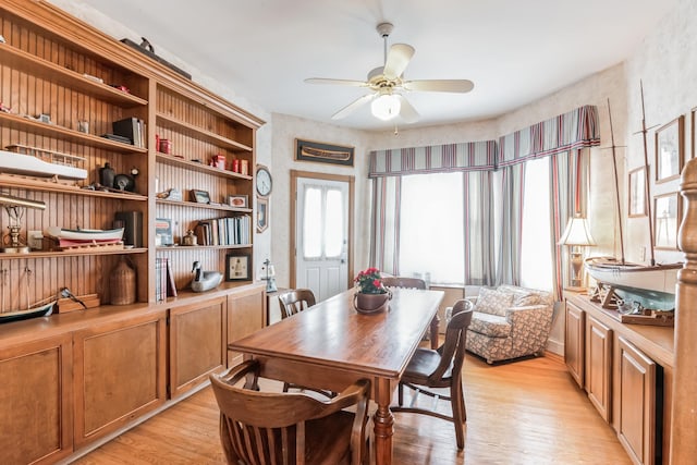 dining area with ceiling fan and light wood-type flooring