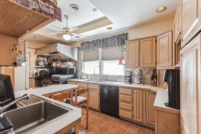 kitchen featuring dishwasher, a raised ceiling, sink, ceiling fan, and light brown cabinetry