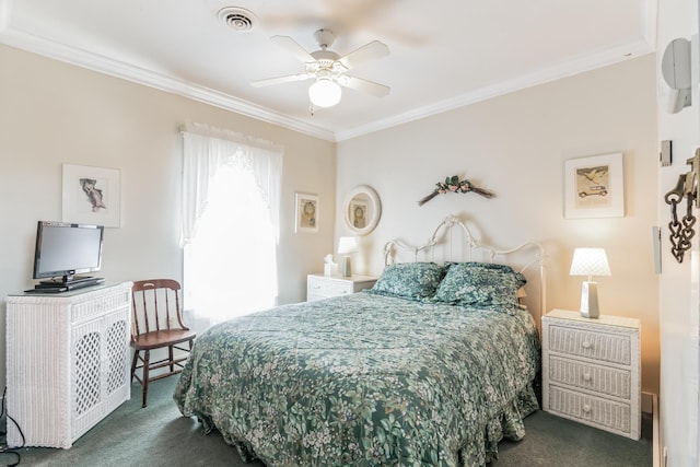 carpeted bedroom featuring ceiling fan and crown molding