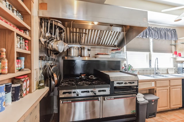 kitchen featuring extractor fan, sink, and light brown cabinetry