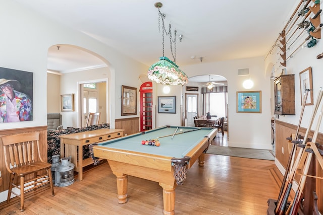 rec room with ceiling fan, light hardwood / wood-style floors, ornamental molding, and billiards