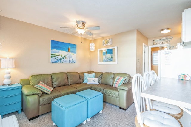 living room featuring ceiling fan and light carpet