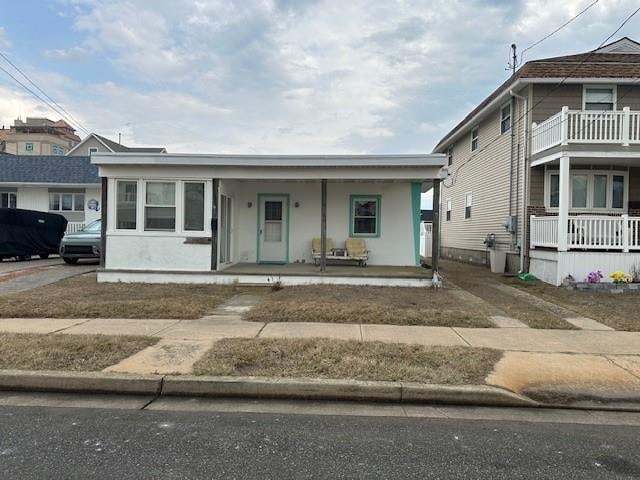 view of front of property featuring a porch and stucco siding