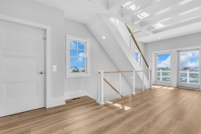 additional living space featuring visible vents, recessed lighting, baseboards, and wood finished floors