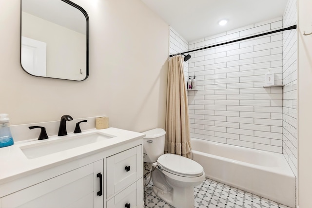full bath featuring vanity, toilet, and shower / tub combo