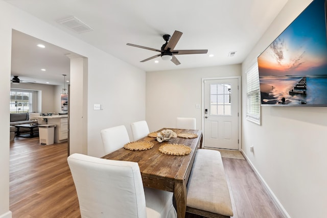 dining space with visible vents, light wood-style flooring, recessed lighting, and a ceiling fan