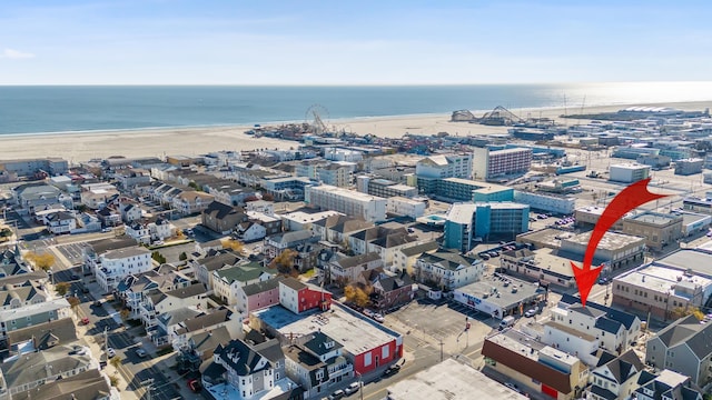 bird's eye view with a beach view and a water view