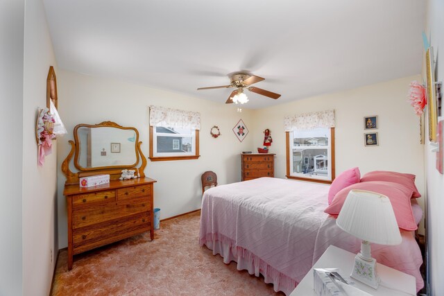 carpeted bedroom with ceiling fan