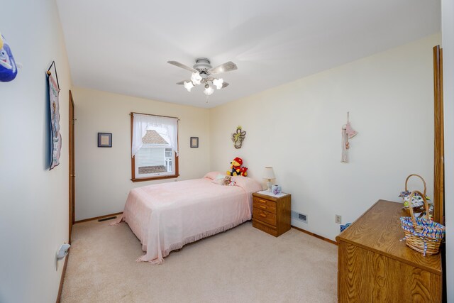 carpeted bedroom featuring ceiling fan