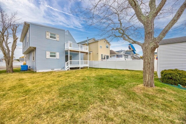 rear view of property with a lawn