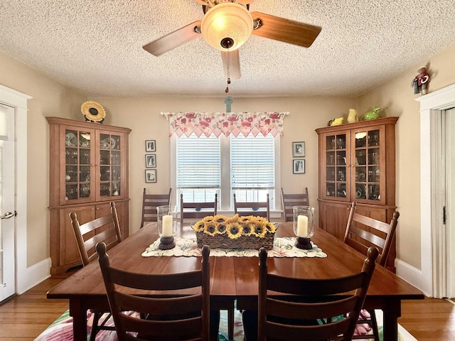 168 98th St, Stone Harbor, NJ 08247 - dining area with a ceiling fan, a textured ceiling, and wood finished floors