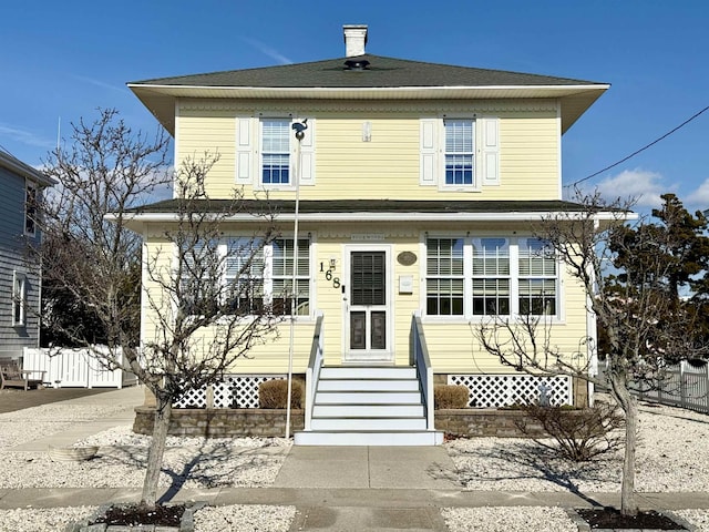 168 98th St, Stone Harbor, NJ 08247 - view of front facade with fence and entry steps