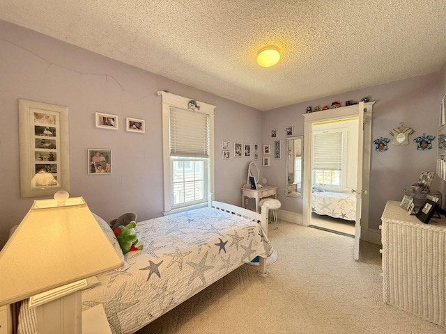 168 98th St, Stone Harbor, NJ 08247 - bedroom with a textured ceiling and light carpet