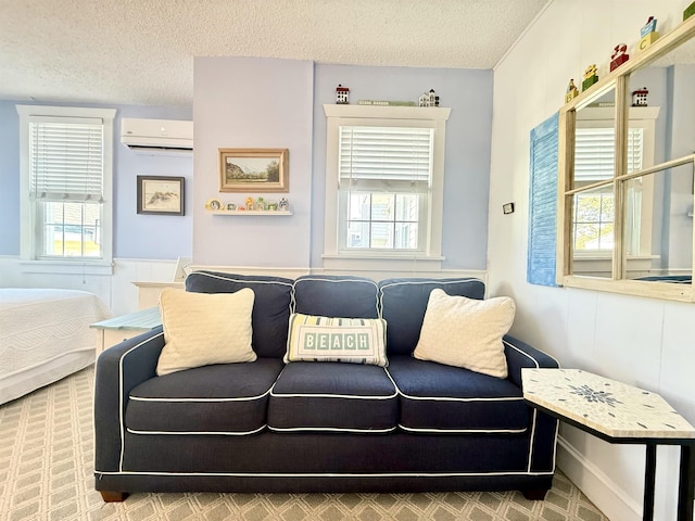 168 98th St, Stone Harbor, NJ 08247 - sitting room with an AC wall unit, a textured ceiling, wainscoting, and a healthy amount of sunlight
