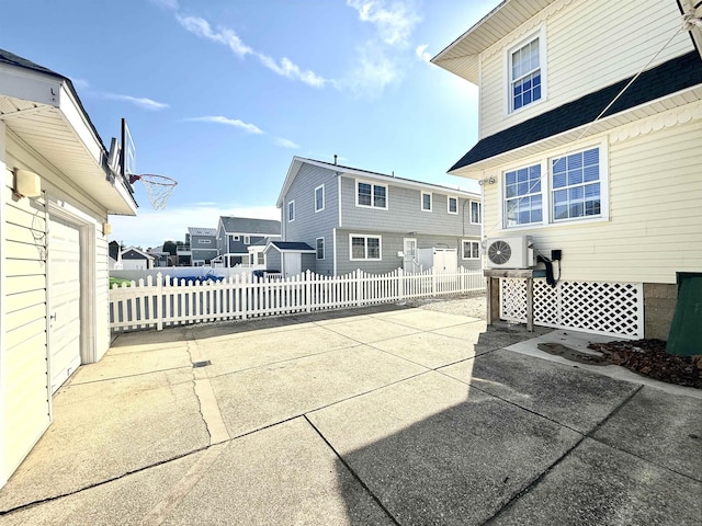 168 98th St, Stone Harbor, NJ 08247 - view of patio featuring fence, ac unit, and a residential view
