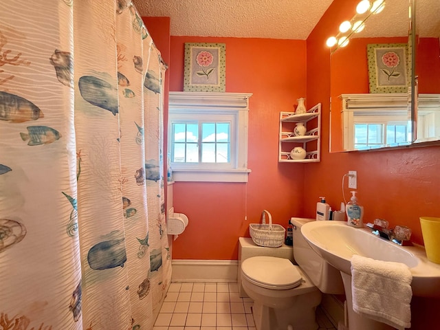 168 98th St, Stone Harbor, NJ 08247 - bathroom featuring toilet, tile patterned floors, a textured ceiling, a shower with shower curtain, and baseboards