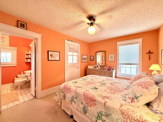 168 98th St, Stone Harbor, NJ 08247 - bedroom with baseboards, multiple windows, carpet, and a textured ceiling