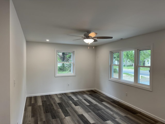 spare room featuring plenty of natural light, dark wood-style flooring, ceiling fan, and recessed lighting