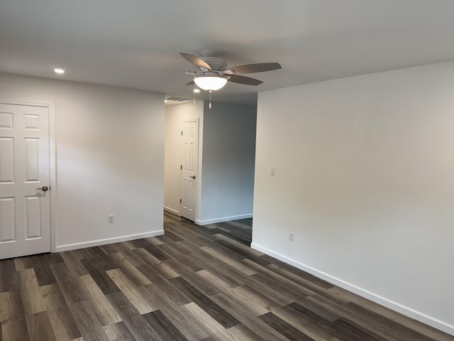 empty room with recessed lighting, ceiling fan, baseboards, and dark wood-type flooring