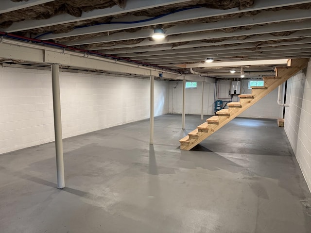 below grade area featuring stairs and electric panel