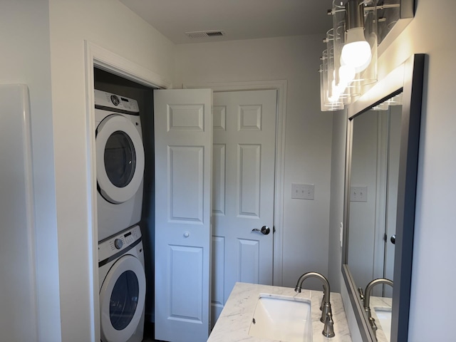 washroom with stacked washer / dryer