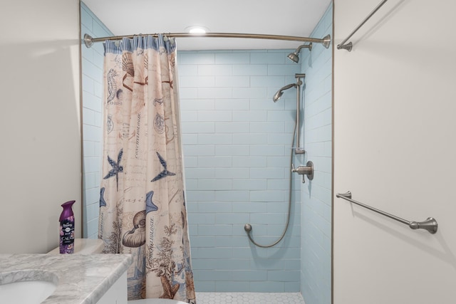 bathroom featuring vanity and a shower with shower curtain