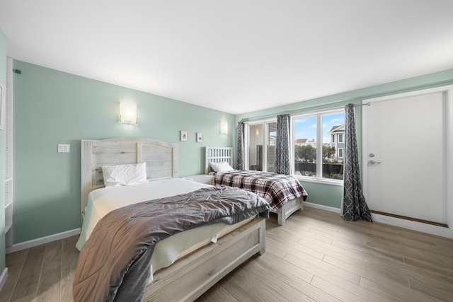 bedroom with wood-type flooring